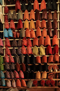 Full frame shot of multi colored shoes in shelf for sale