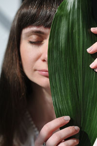 Close-up of woman with eyes closed