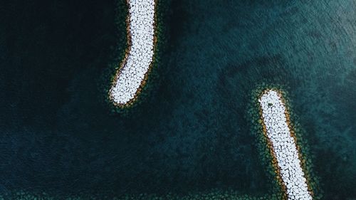 High angle view of groyne in sea