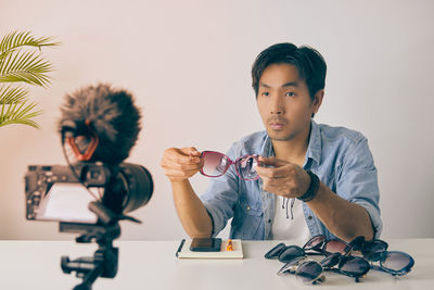 Portrait of boy looking at camera on table