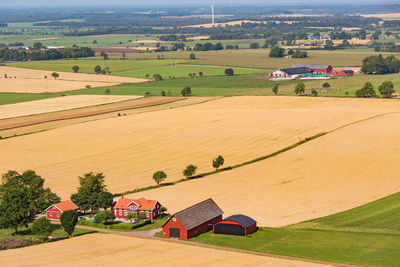 High angle view of houses by agricultural field