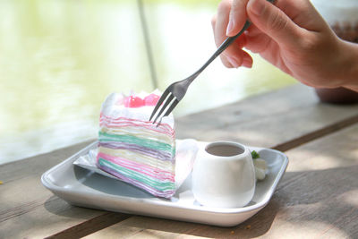 Close-up of hand holding ice cream