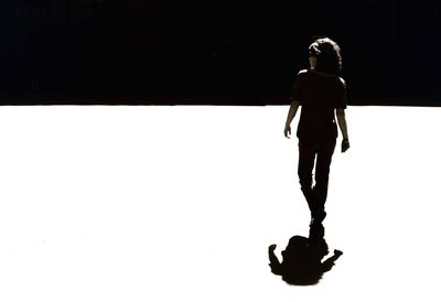 Woman standing in the dark