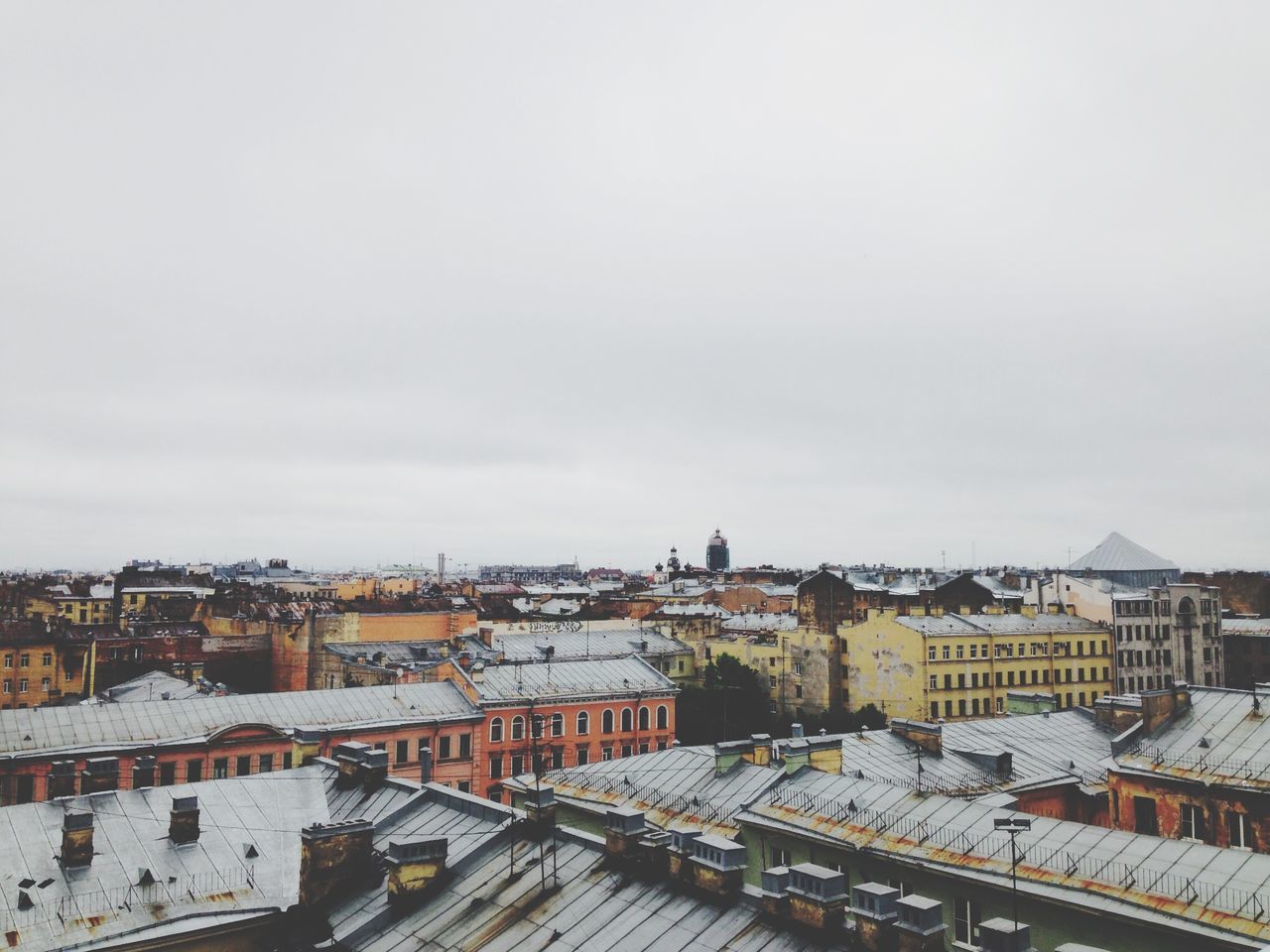 architecture, building exterior, built structure, city, high angle view, sky, transportation, cityscape, residential building, residential district, residential structure, roof, railroad track, winter, weather, road, day, street, outdoors, snow