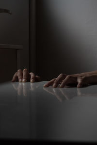 Cropped hands of person on table