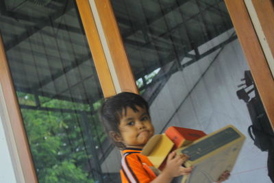 Portrait of boy looking at home