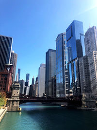 Modern buildings in city against sky