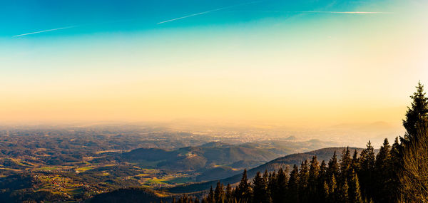 Scenic view of silhouette mountains against sky at sunset