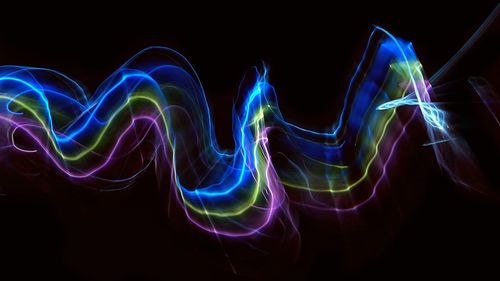 Abstract light painting against black background