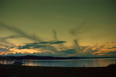 Scenic view of lake at sunset