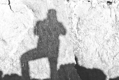 Shadow of man standing on floor