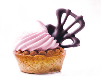 Close-up of chocolate cake against white background