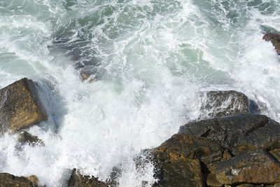 Sea waves splashing on rocks