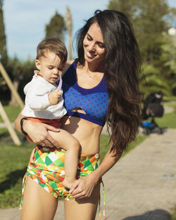 Happy woman with arms raised