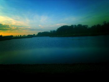 Reflection of trees in calm lake