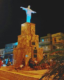 Full length of woman standing at night