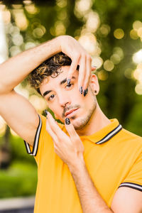 Portrait of young man standing outdoors