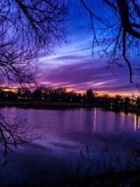 Scenic view of lake against sky at sunset