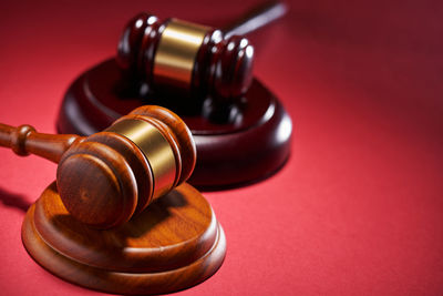 Close-up of gavel on table