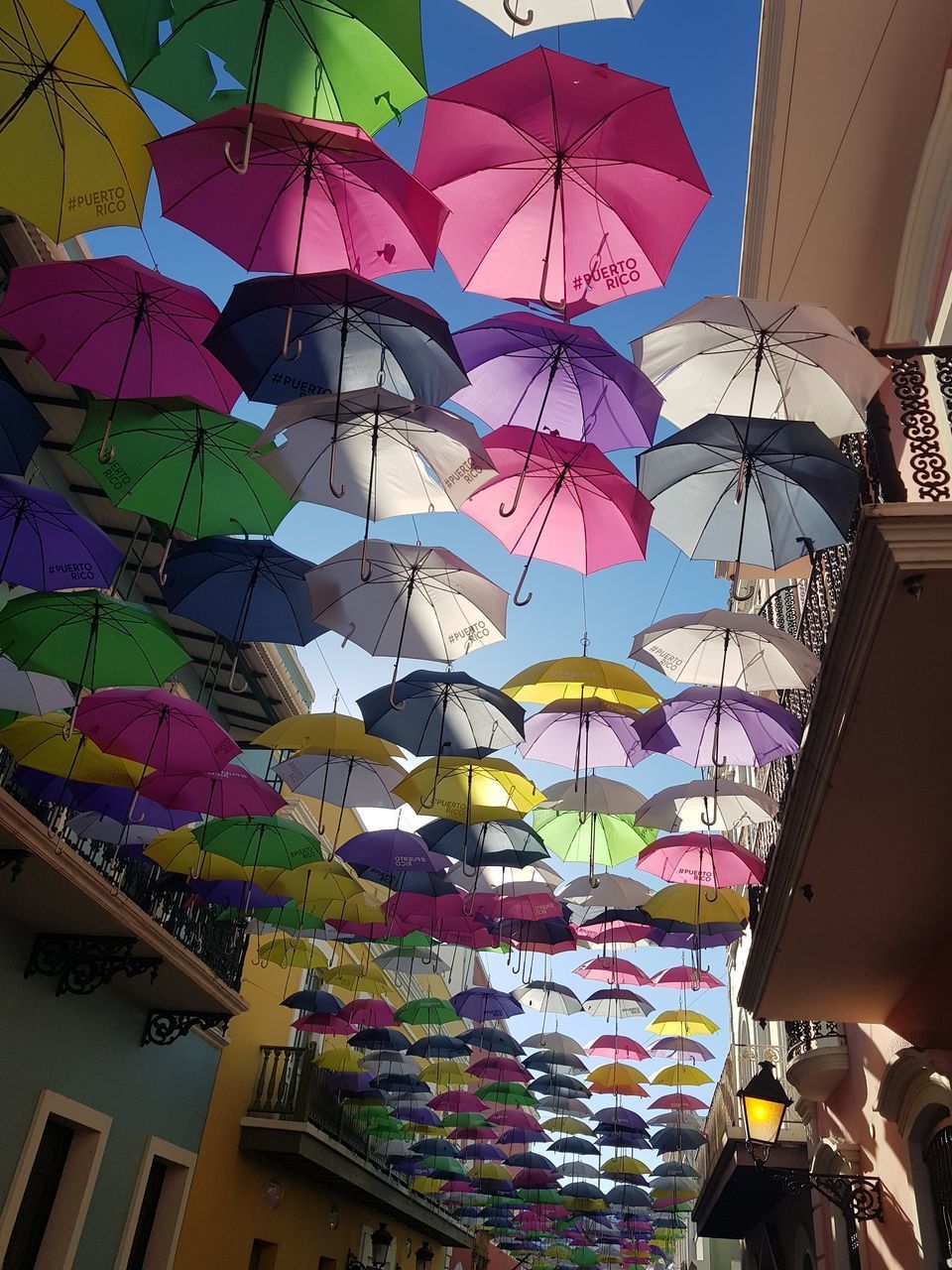 LOW ANGLE VIEW OF DECORATIONS HANGING ON BUILDING