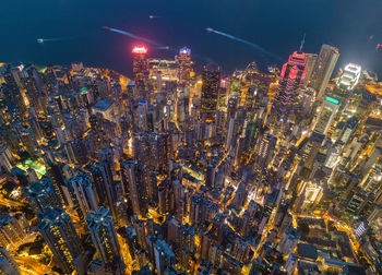 High angle view of illuminated modern buildings in city at night