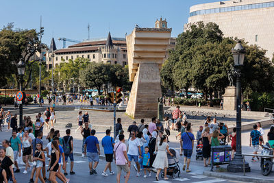 Placa de catalunya or catalonia square in barcelona, you can see people and tourists, spain.