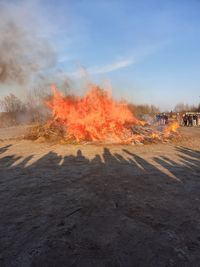 View of fire on road against sky