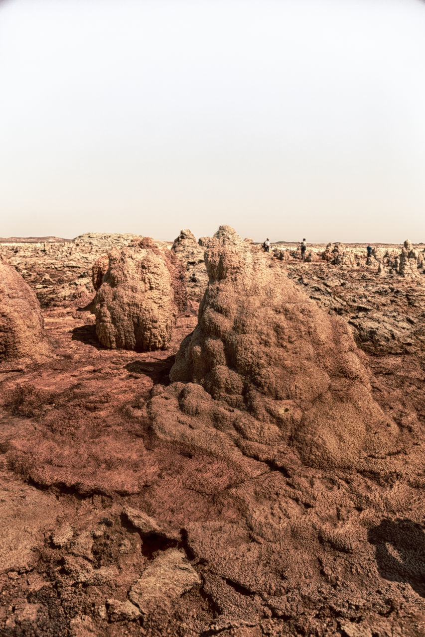 ROCK FORMATION IN DESERT AGAINST SKY