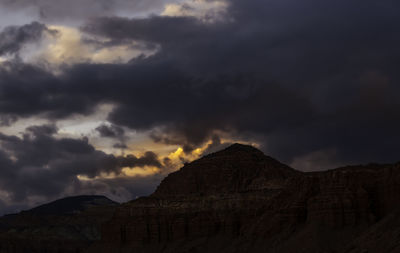 Low angle view of dramatic sky over mountain