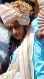 Young woman wearing turban during sunny day