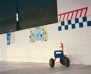 Shopping cart against wall