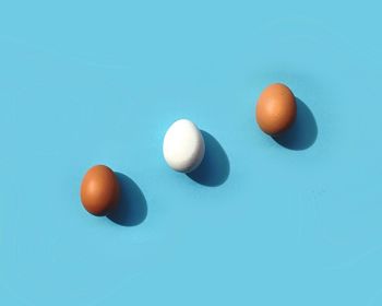 Three eggs on blue background