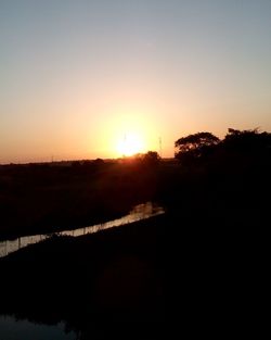 Scenic view of landscape at sunset