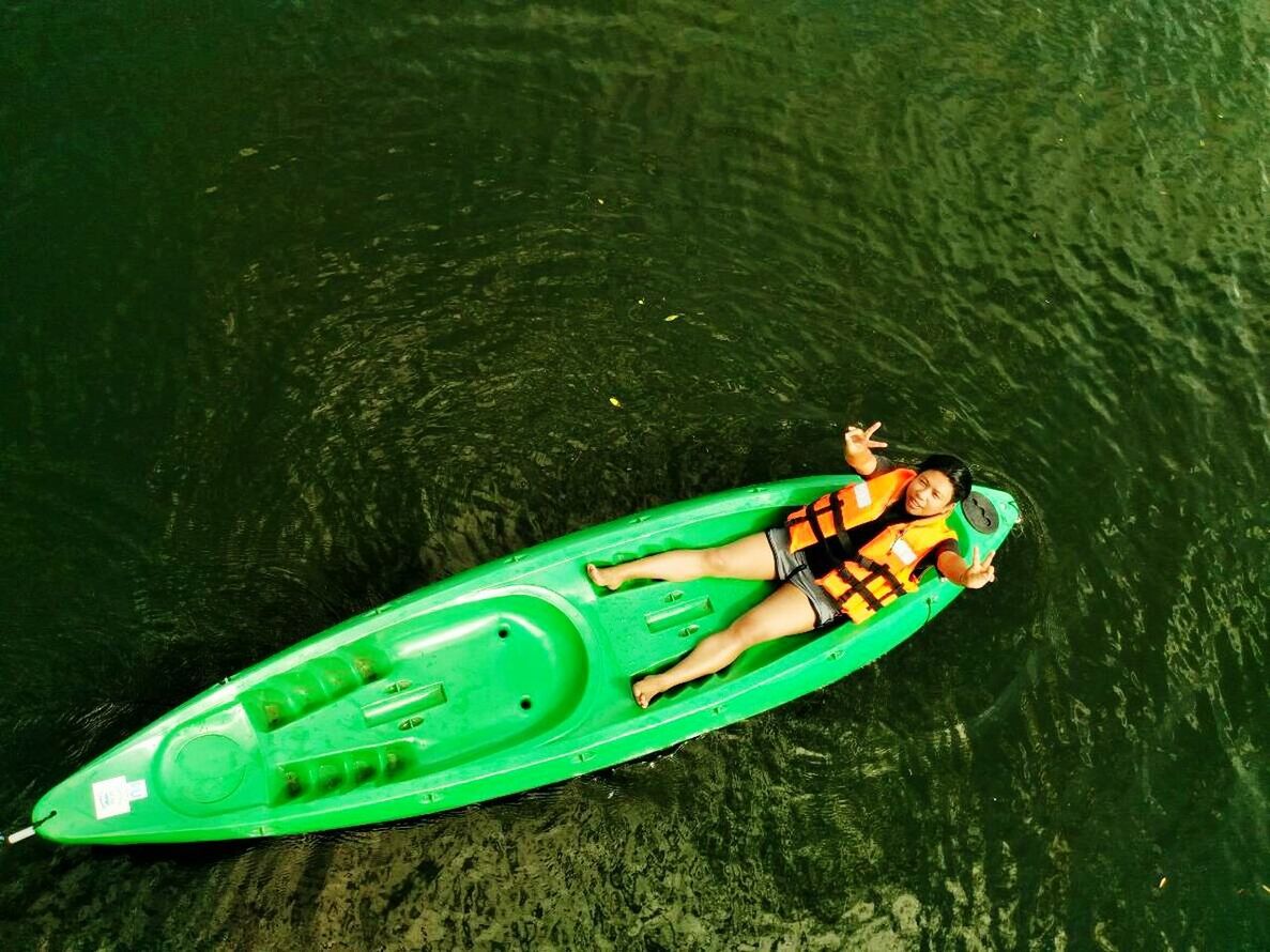 water, leisure activity, nautical vessel, trip, vacations, holiday, men, adult, togetherness, nature, high angle view, two people, transportation, adventure, floating on water, enjoyment, kayak, green color, lake, couple - relationship, inflatable, outdoors, positive emotion