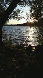 Scenic view of lake at sunset