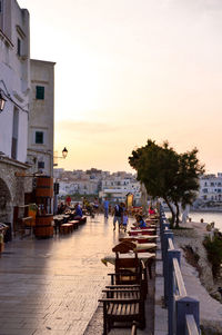 View of buildings in city at sunset