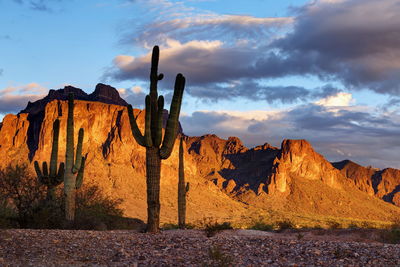 View of rock formation against cloudy sky