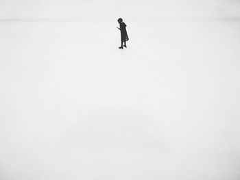 Full length of man skiing on snow