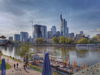 Panoramic view of river and buildings against sky