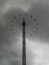 Low angle view of birds flying against sky