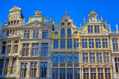 Low angle view of building against blue sky