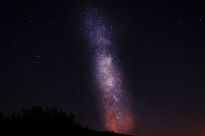 Fireworks against sky at night