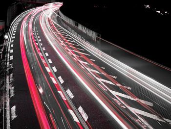 High angle view of light trails on highway at night