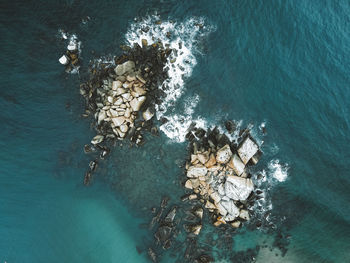 High angle view of rock in sea