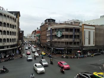 Vehicles on road along buildings