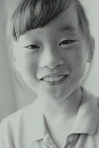 Close-up portrait of smiling girl