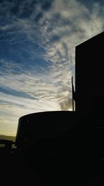 Low angle view of building against cloudy sky