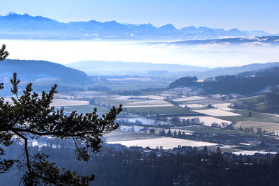 Scenic view of mountains against sky during winter