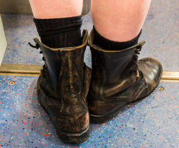 Low section of man standing on floor