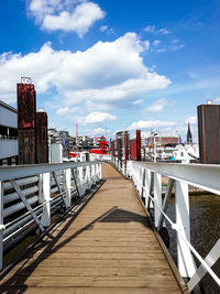 View of bridge and buildings against sky